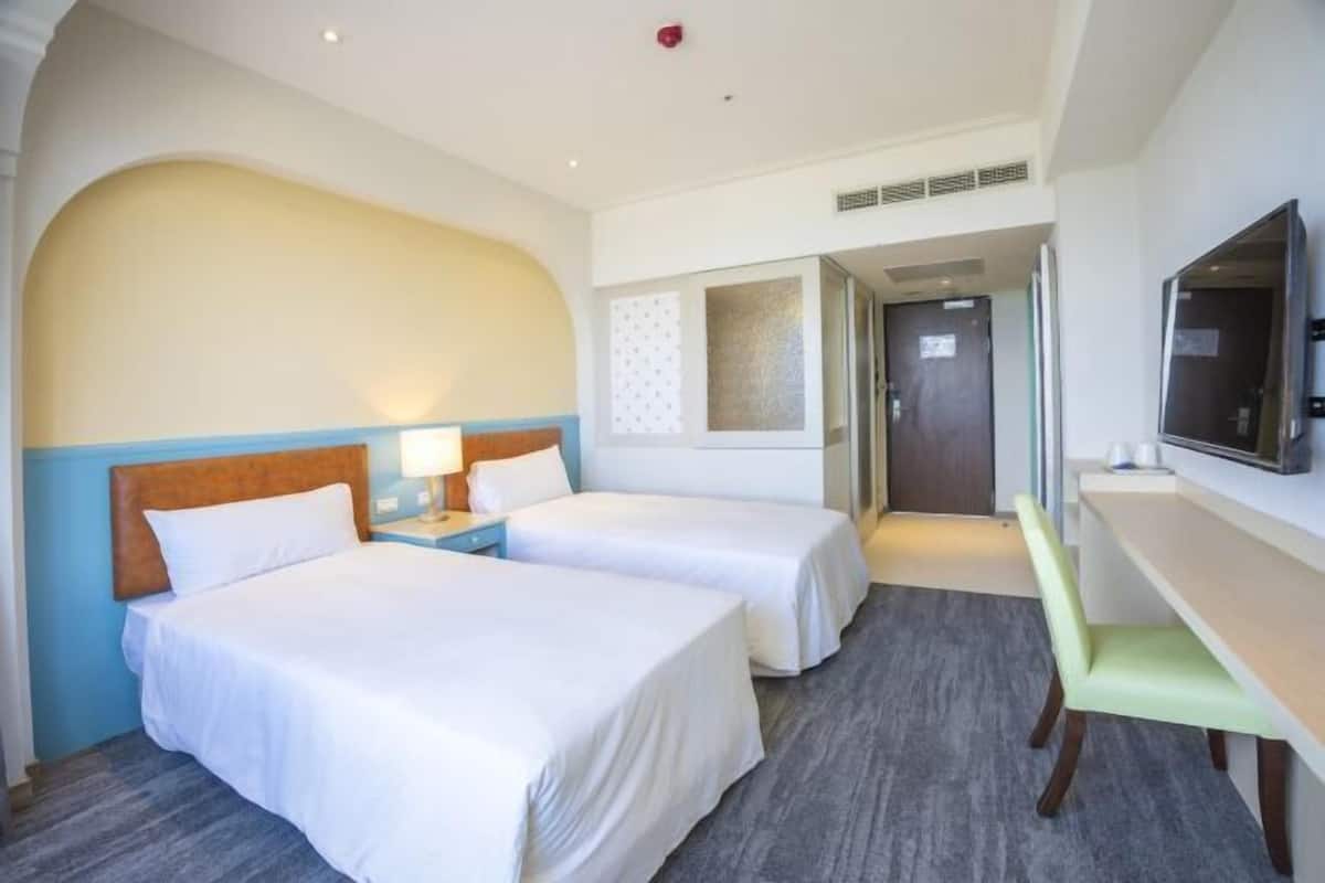 Luxe beddengoed, donzen dekbedden, een minibar, een kluis op de kamer