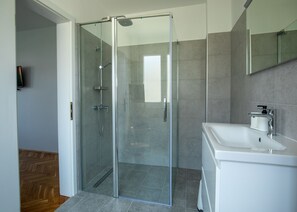 Shower, hair dryer, towels, soap