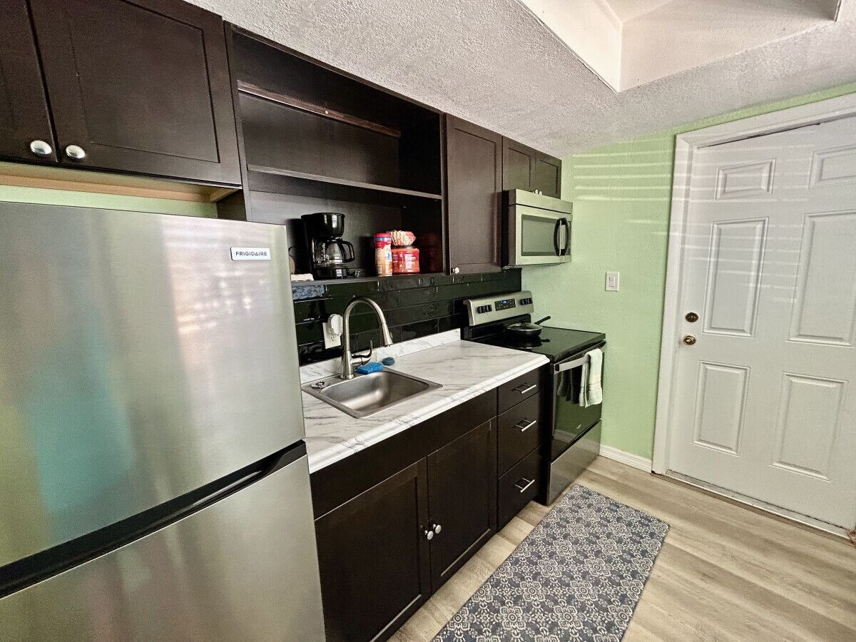 Fridge, coffee/tea maker, cookware/dishes/utensils