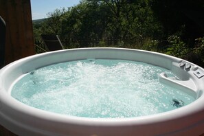 A hot tub with a wooden deck and a view of trees. - The Nook - Farm Park Stay with Hot Tub, BBQ & Fire Pit (Swansea)