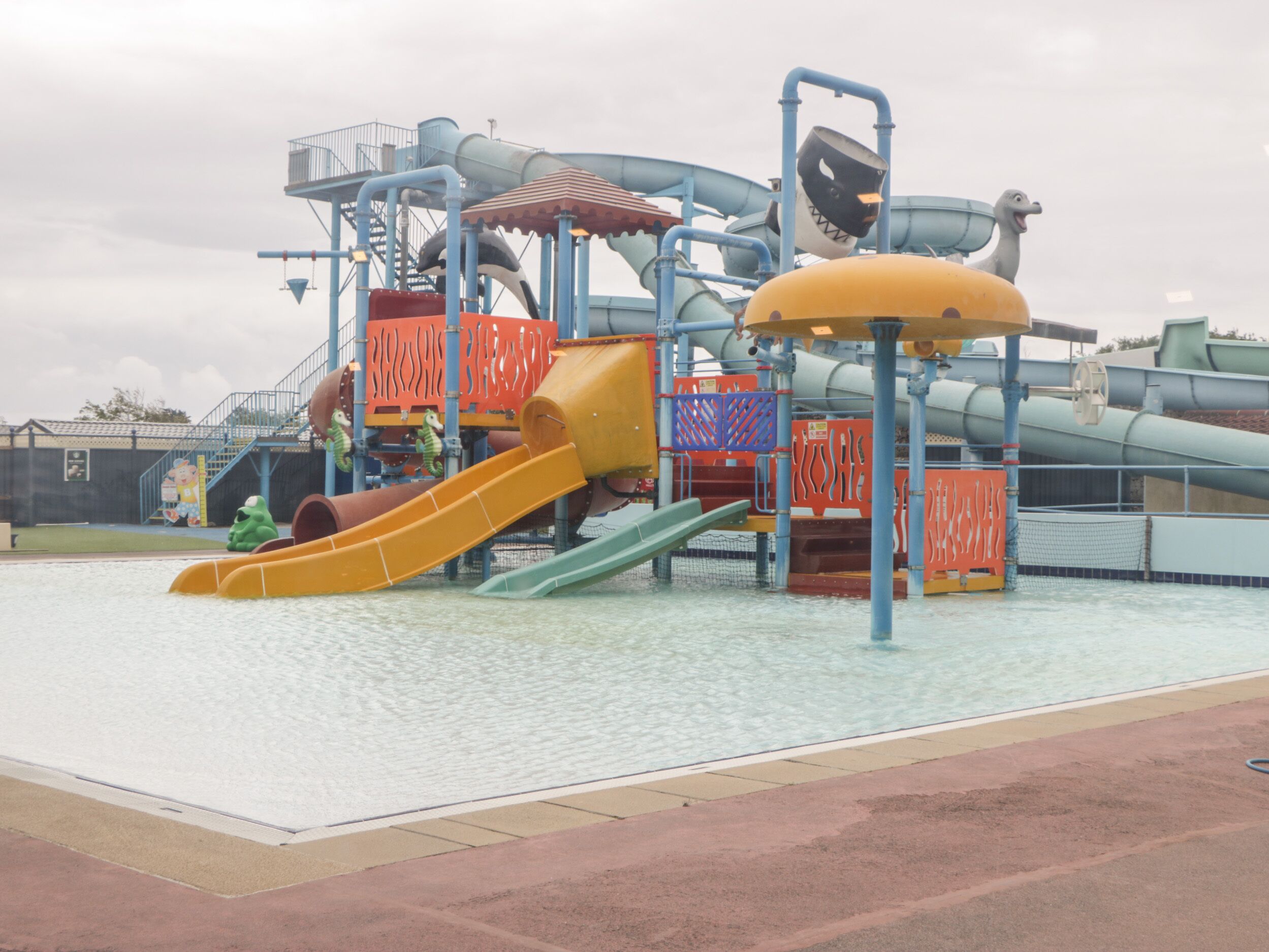 A water park with multiple slides and play structures.