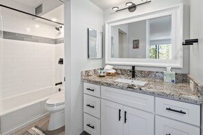 Combined shower/tub, hair dryer, towels, soap
