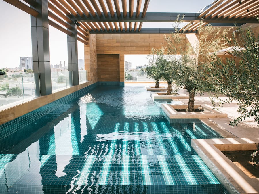 Outdoor pool, open 6:00 AM to 6:00 PM, pool umbrellas, pool loungers