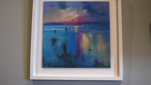 A framed painting of a sunset over the ocean. - Crown Inn (Penzance)