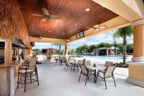 Outdoor dining - Family-Fun Home Resort, Poolside Disney Getaway! (Kissimmee)