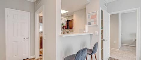 Counter at bar height with two high chairs