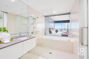 Bathtub, hair dryer, towels, soap