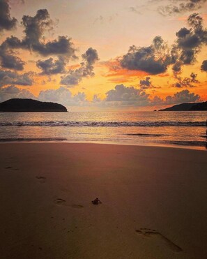 On the beach, sun loungers, beach towels