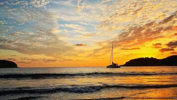 On the beach, sun loungers, beach towels