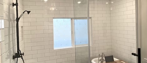 Bathtub, hair dryer, towels, soap