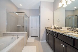 Bathtub, hair dryer, towels, soap