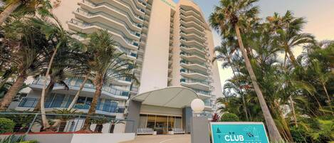A multi-story hotel with a prominent sign reading "CLUB WYNDHAM".
