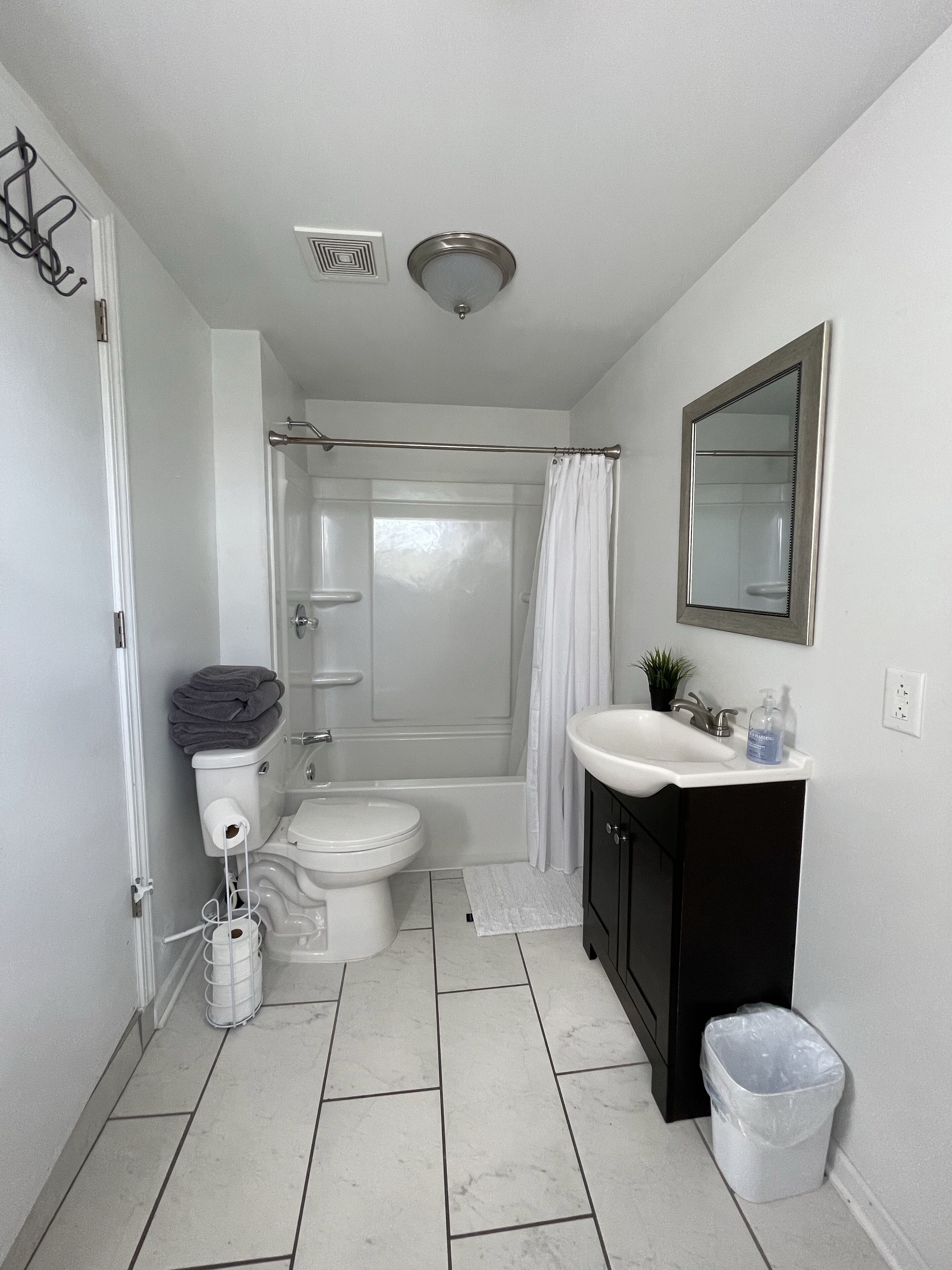 Bathtub, hair dryer, towels