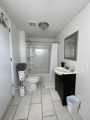 Bathtub, hair dryer, towels