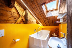 Bathtub, hair dryer, towels