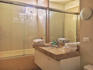 Bathtub, hair dryer, towels, soap