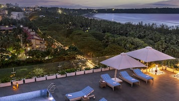 Indoor pool, open 7:00 AM to 7:00 PM, pool loungers