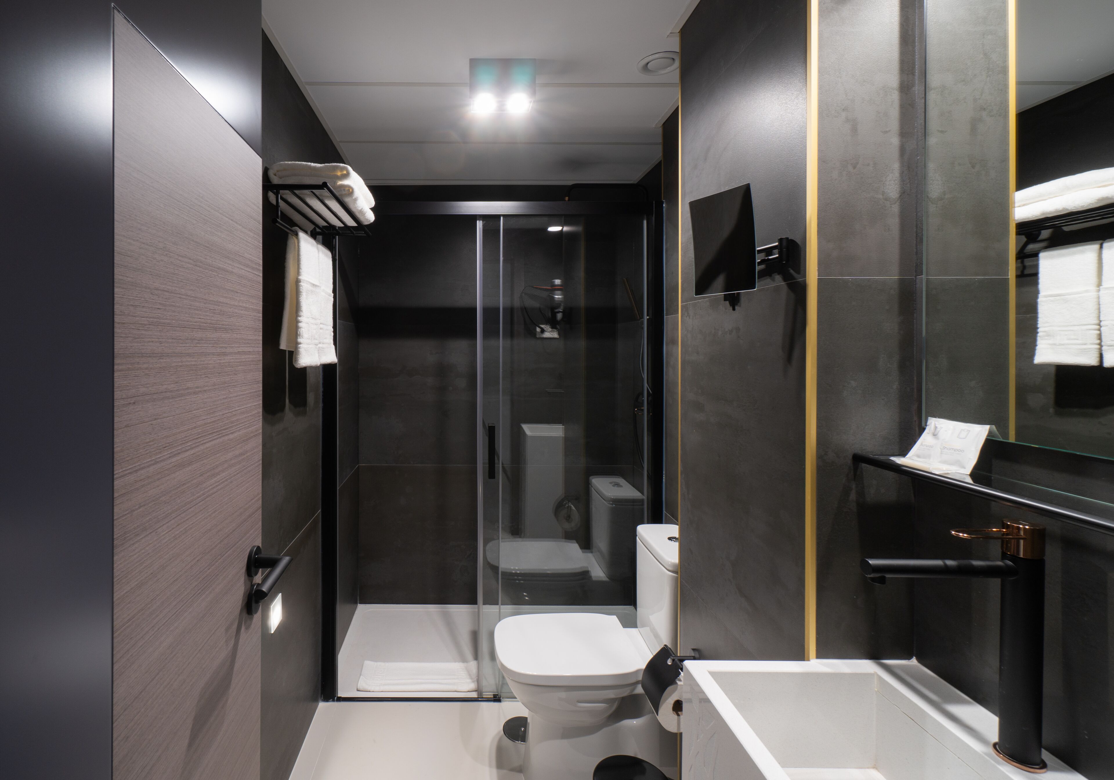 shower, rainfall showerhead, hair dryer, towels