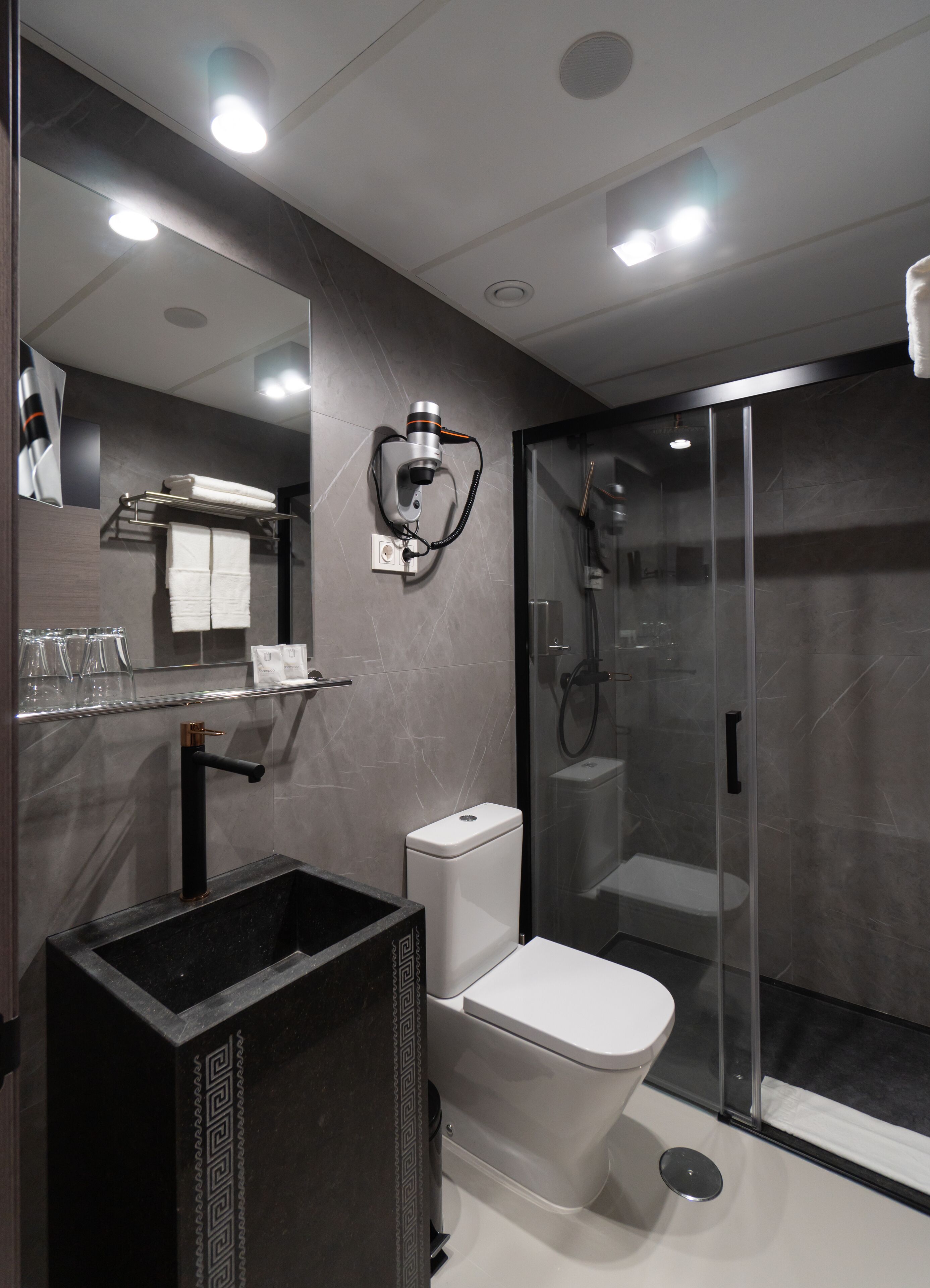 standard double room | bathroom | shower, rainfall showerhead, hair dryer, towels