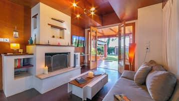 Family Villa, Multiple Bedrooms, 2 Bathrooms (Villa Revita Kourouta beach) | Living area | 21-inch flat-screen TV with satellite channels, TV, fireplace