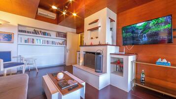 Family Villa, 2 Bedrooms, 2 Bathrooms (Villa Revita Kourouta beach) | Living room | 21-inch flat-screen TV with satellite channels, TV, fireplace