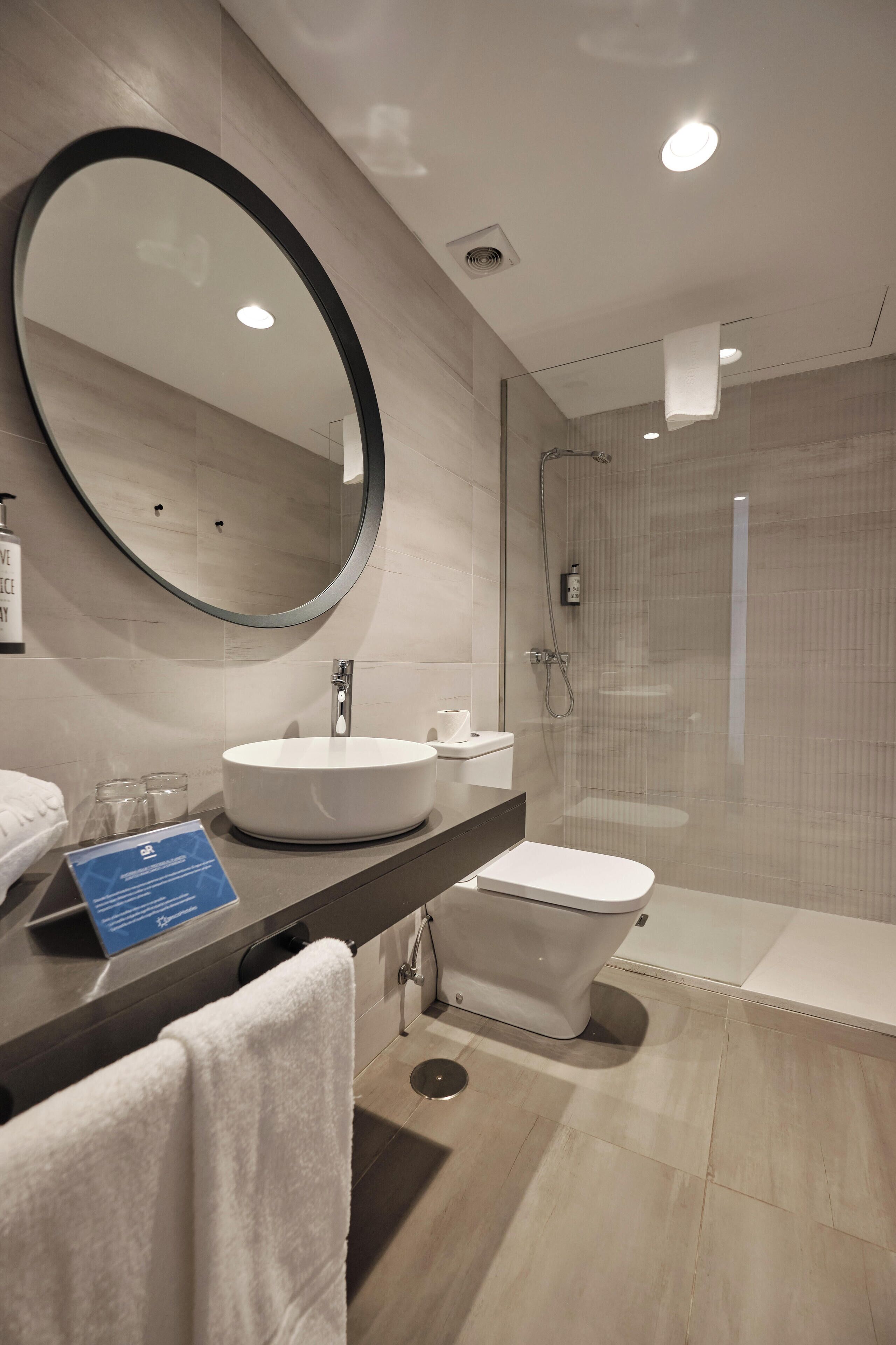 superior double or twin room | bathroom | shower, hair dryer, towels, soap