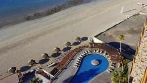 An aerial view of a resort with a swimming pool, beach, and lounge area. - Sonoran Sky 1107 Spacious Deluxe Best Ocean View Condo (Puerto Peñasco)