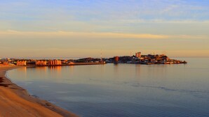 A coastal cityscape with a wide sandy beach and calm waters. - Sonoran Sky 1107 Spacious Deluxe Best Ocean View Condo (Puerto Peñasco)
