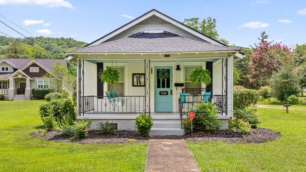 A single-story house with a front porch, a green door, and a mailbox. - Genevieve's Cottage! Totally Renovated with all the Charm! (Hixson)