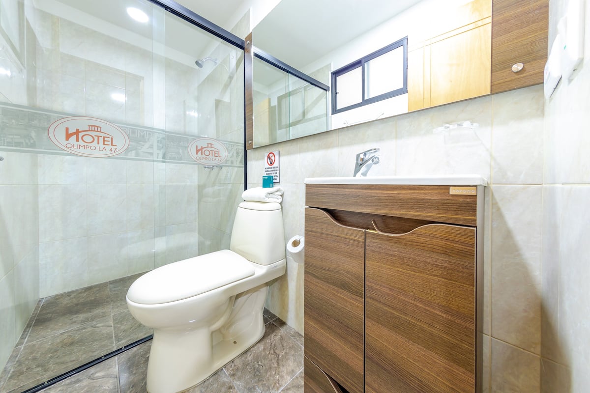 standard double room | bathroom | shower, free toiletries, towels, soap