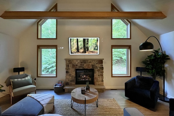 Living room seating area, Samsung frame tv, and gas fireplace