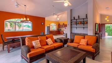 Basic Villa | Living area | 32-inch flat-screen TV with cable channels, TV