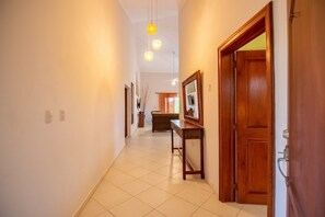 Basic Villa | Living area | 32-inch flat-screen TV with cable channels, TV