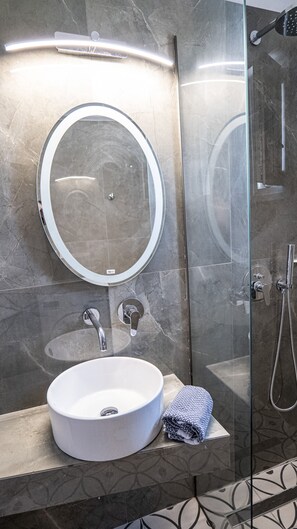 Shower, hair dryer, towels, toilet paper