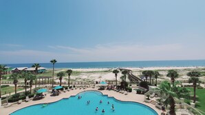 A resort with a large pool, beach access, and palm trees. - A409 King/Twin bunk & Full bed/ Sofa Sleeper-Beach Front-Pools - sleeps 8 (Gulf Shores)