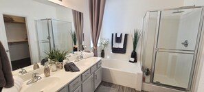 Combined shower/tub, hair dryer, towels, soap