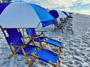 On the beach, sun-loungers