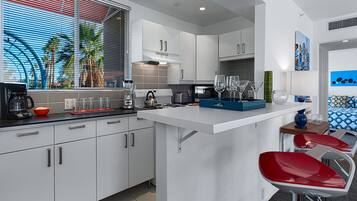 Deluxe Room, 1 King Bed | Private kitchen | Full-sized fridge, microwave, oven, stovetop