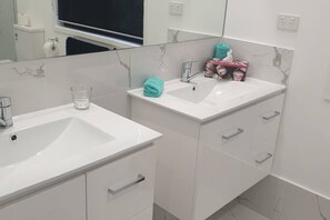 Shower, hair dryer, towels