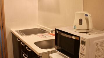 Fridge, microwave, stovetop, cookware/dishes/utensils