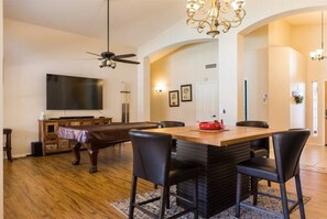 Open family room w/ large HDTV, billiards table, and extra dining space - Large oasis, pool heater, spa, putting green (Avondale)