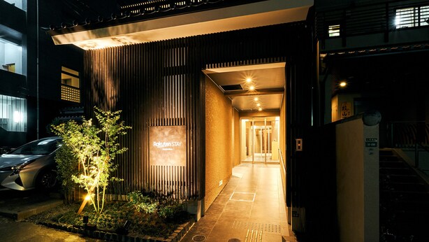 A building entrance with a sign reading "Rakuten Stay." - Rakuten STAY Hakata Gion (Fukuoka)