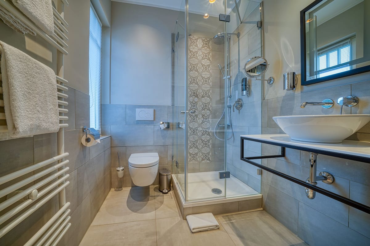 boutique double room | bathroom | shower, hair dryer, towels