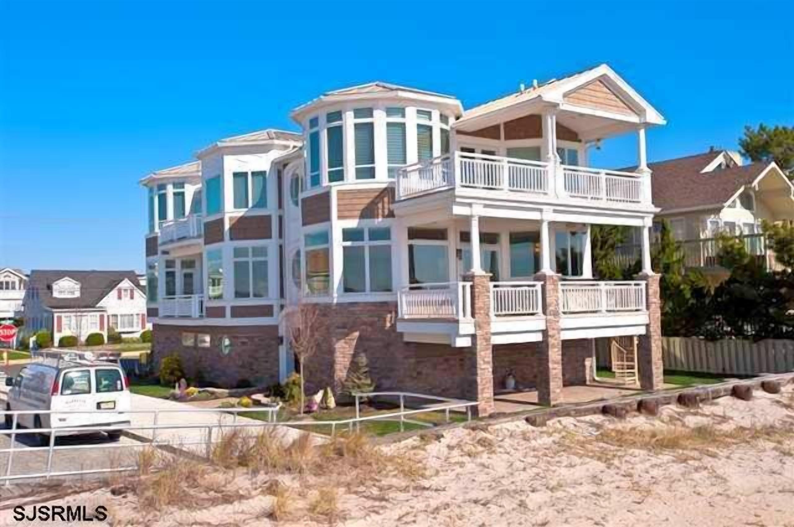 Super upscale, one of a kind designed beach front property just steps away from the beach