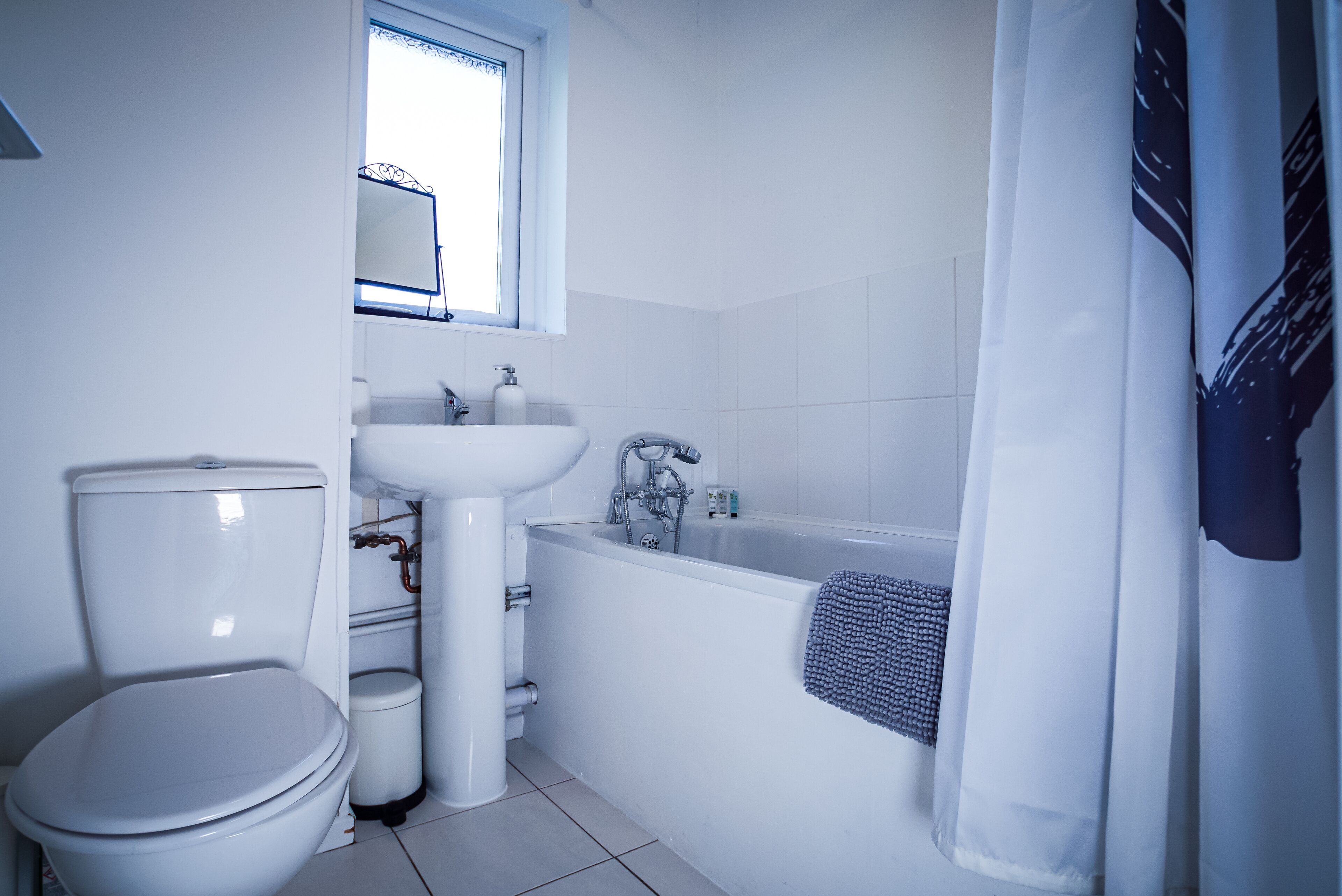 Combined shower/bathtub, hair dryer, towels, soap