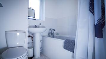 Combined shower/bathtub, hair dryer, towels, soap