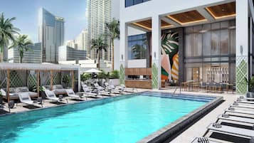 Una piscina al aire libre, camas de piscina gratis