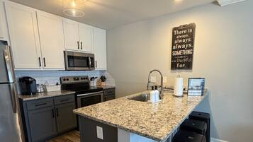 Fridge, coffee/tea maker, cookware/dishes/utensils