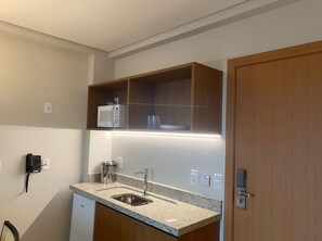 Fridge, microwave, cookware/dishes/utensils, dining tables