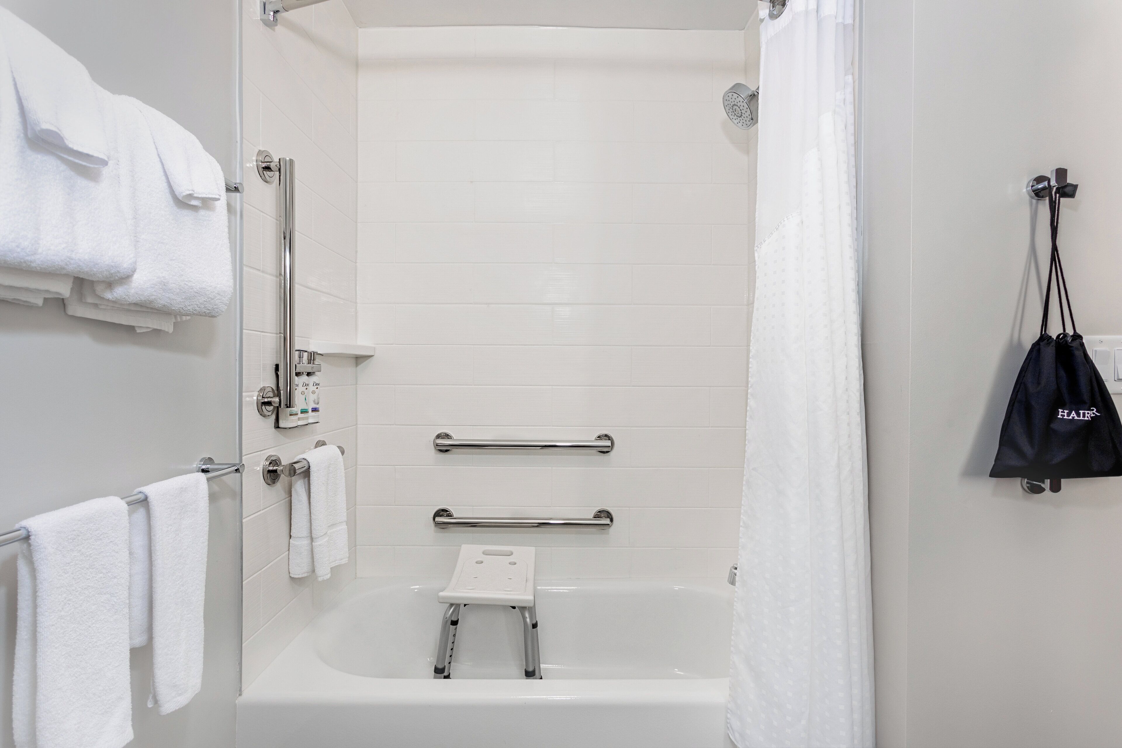 hair dryer, towels, soap, shampoo